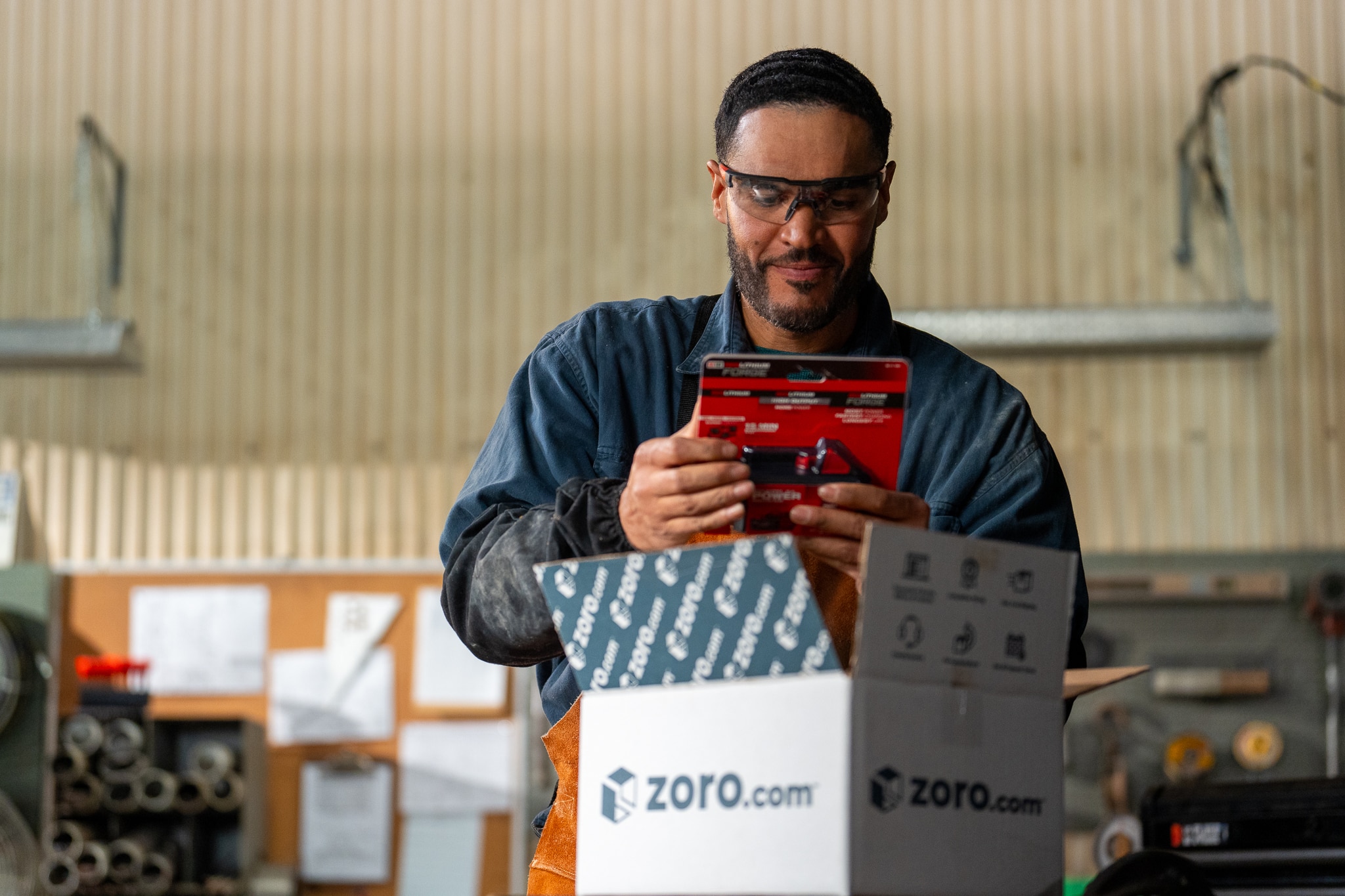 Man taking tools out of a Zoro shipping box