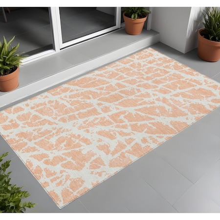 Homeroots 3' X 5' Peach and Ivory Abstract Washable Non Skid Indoor Outdoor Area Rug 559292