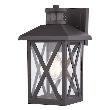 Vaxcel Rockford Outdoor Bronze Motion Dusk to Dawn Wall Sconce with Clear Seeded Glass Shade T0844