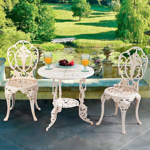 cast iron garden table and 2 chairs