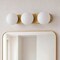 Jonathan Y Knox 23.3 in. 3-Light Mid-Century Modern Metal and Frosted Glass Globe LED Vanity Light, Brass Gold JYL9567A - alternate 9